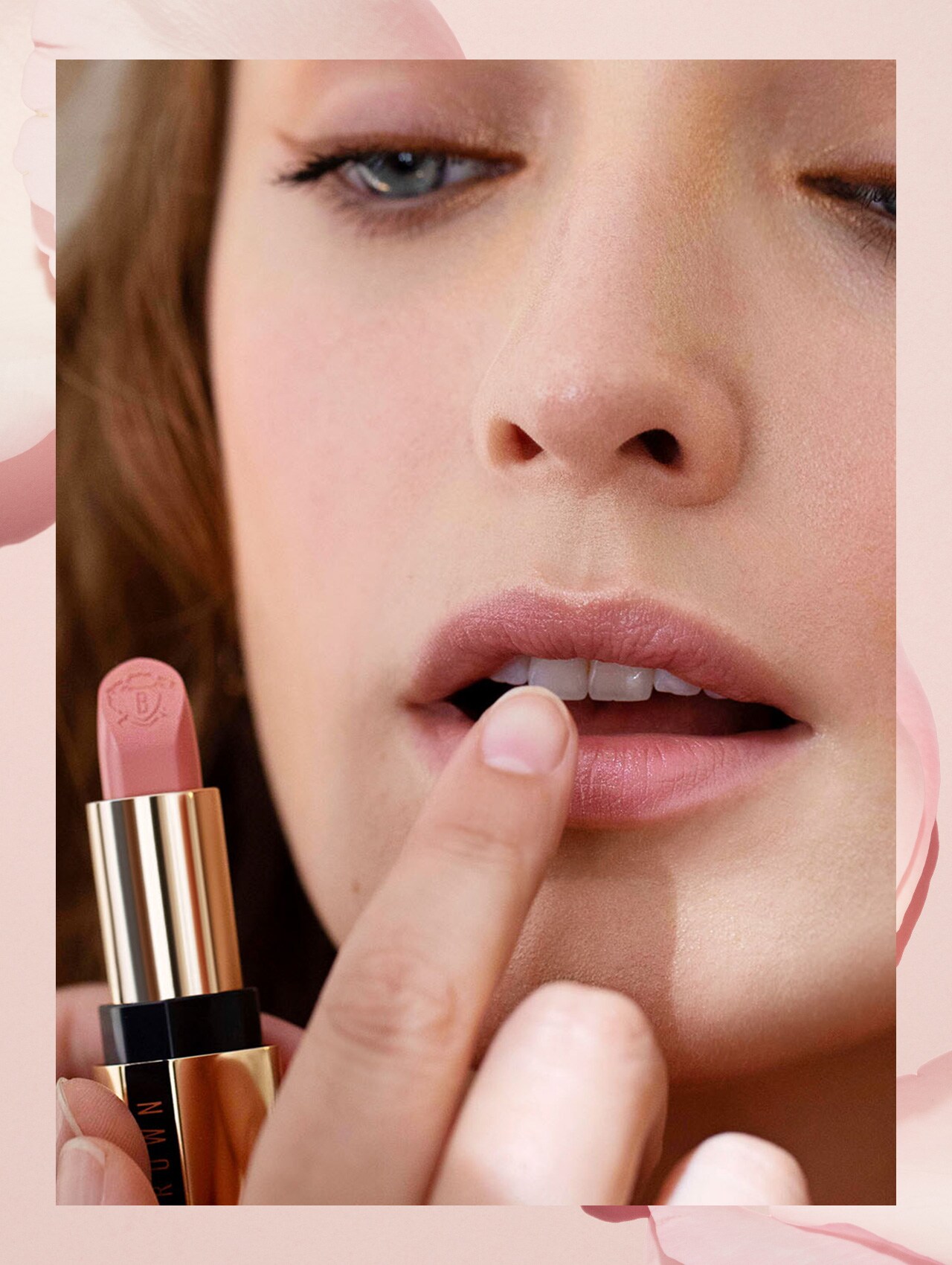 Imagine containing step 5 model applying lipstick, smiling while looking into compact Bobbi Brown mirror