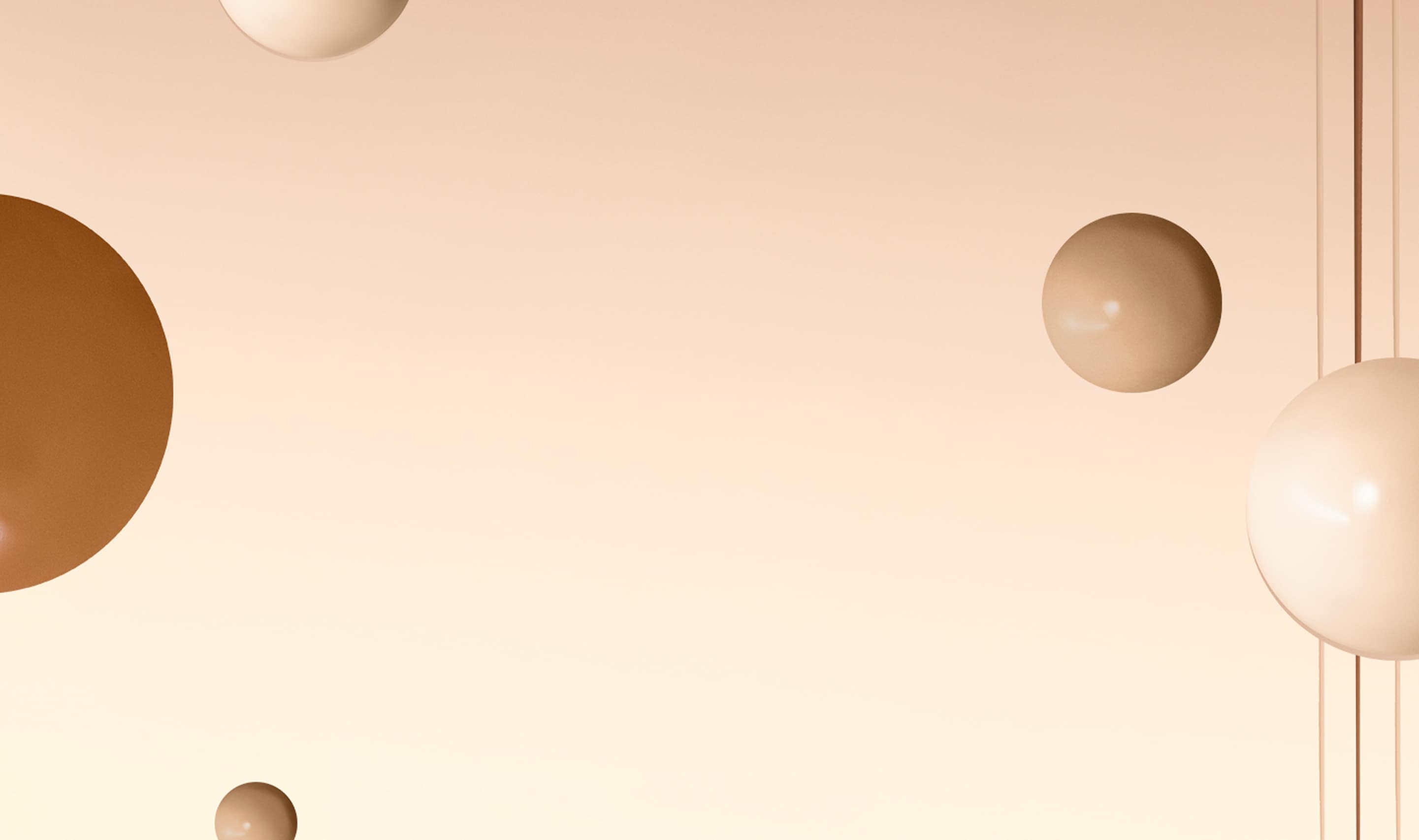 Background image containing skin-toned gradient with Vitamin Enriched Skin Tint foundation spheres floating